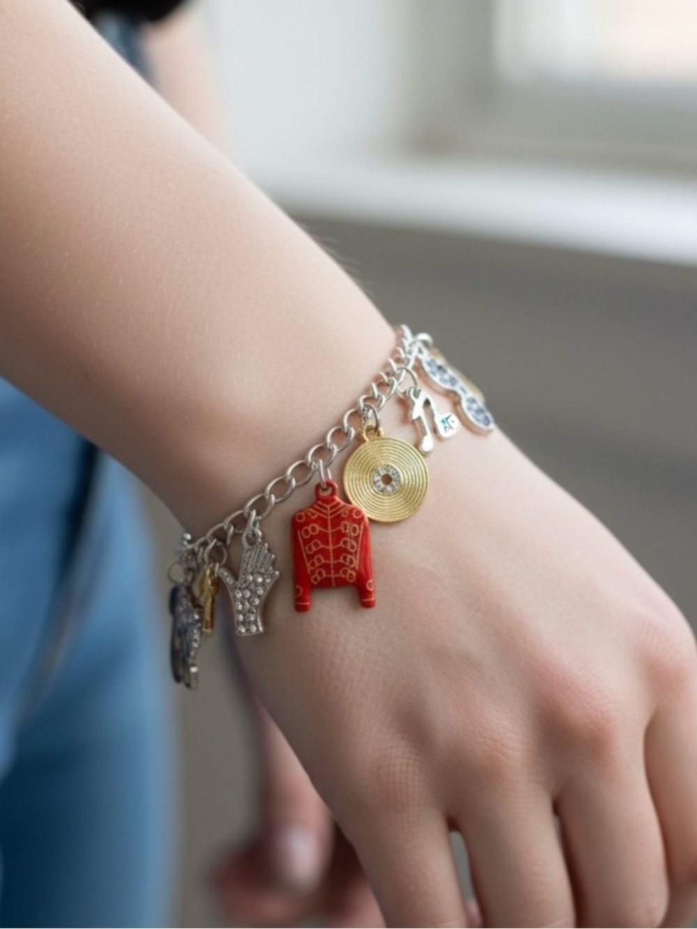 Silver Charm Bracelet with Red Sweater and Gold Disc Charms